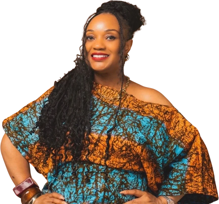 Duchess Nena smiling, hands on hips, in an orange and blue print top